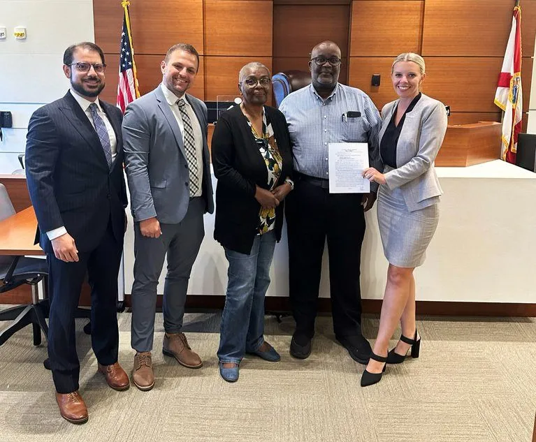 Amanda Demanda and co-counsel after the $43 million car accident case's verdict was delivered