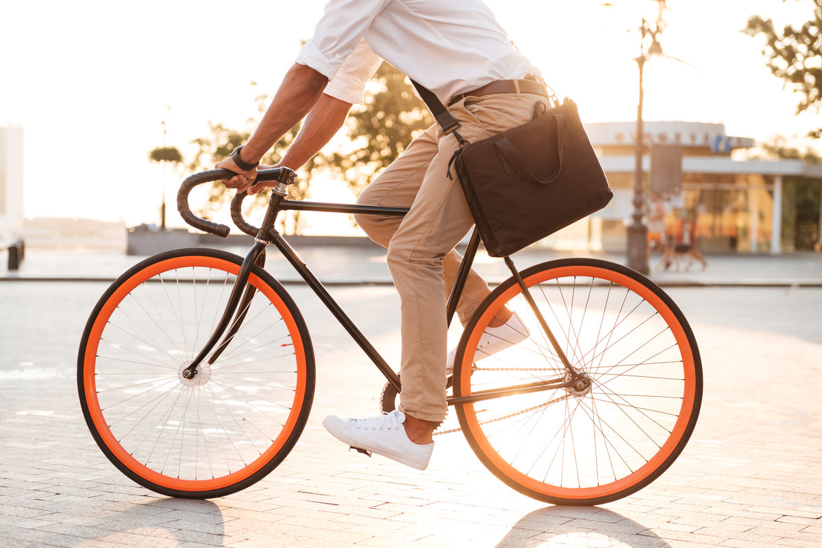 Handsome young african man early morning with bicycle
