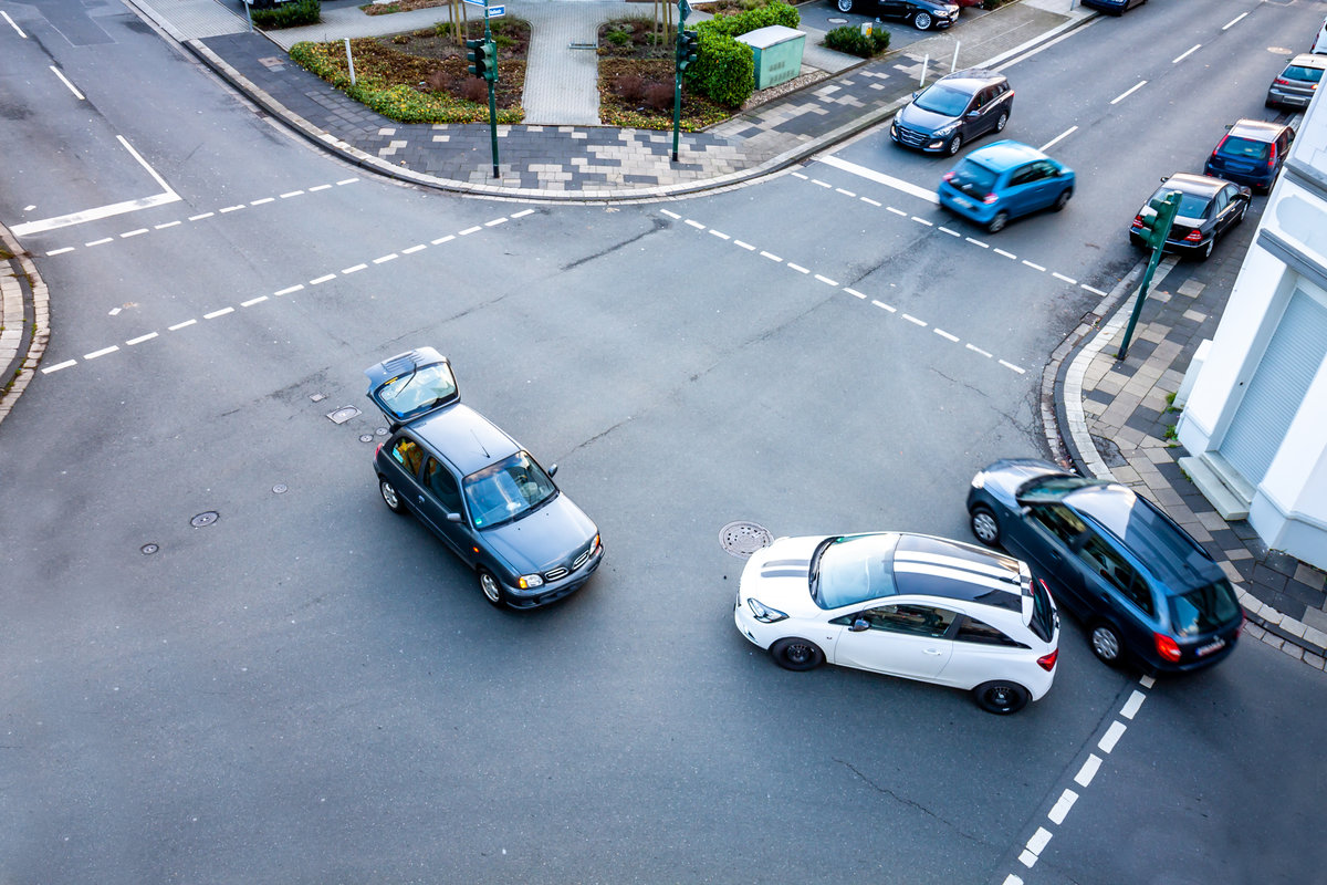Aerial view of car accident on road crossing.