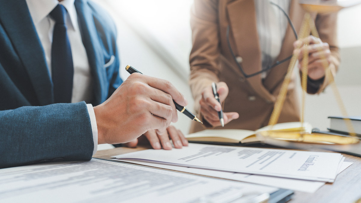 Lawsuit and justice concept, Lawyer working with partner at law firm. legal consulting discussion defendant punishment law in courtroom.