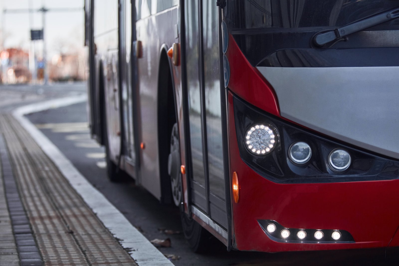 A bus driving down a Florida road, representing a bus accident case handled by Amanda Demanda Injury Lawyers