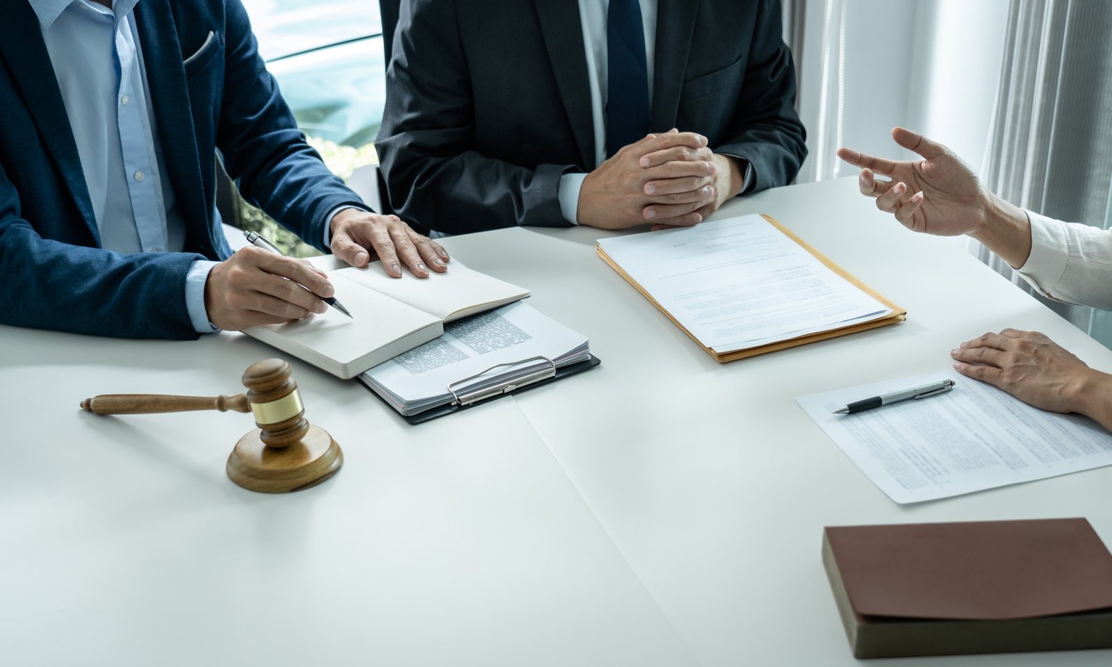 Personal injury attorney consulting with clients at a Miami law firm