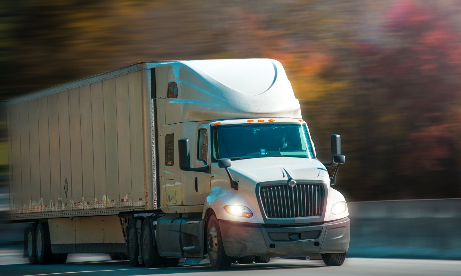 Semi truck driving on a busy Florida highway